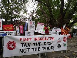 Call to action: As the 1% meet at Davos, protest to say we must #TaxTheRich